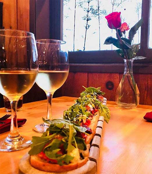 Indulge in our locally famous bruschetta and fine wines